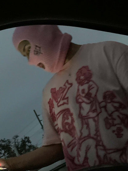 Someone wearing pink ski mask with logo